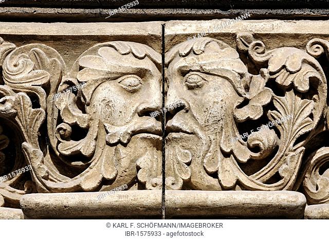 Head to head, two abutting faces, relief in the Romanesque portico, Benedictine Abbey Maria Laach, Eifel, North Rhine-Westphalia, Germany, Europe