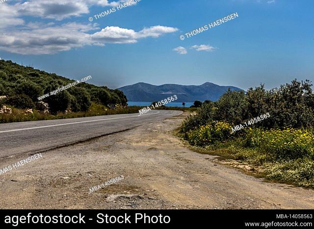 a road leading to the ocean in greece