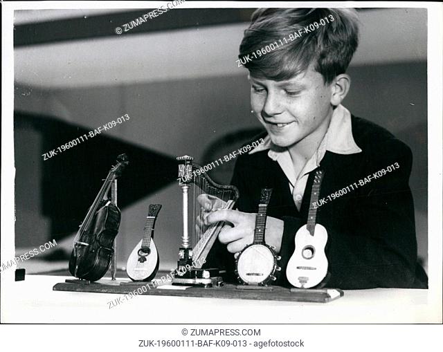 1972 - The Model Engineer Exhibition. Press preview. Keystone Photo Shows: Brian Callahan, 10, of Nunhead, seen examining a Group of five miniature stringed...