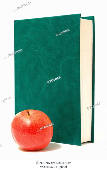 red apple and green book isolated on white background