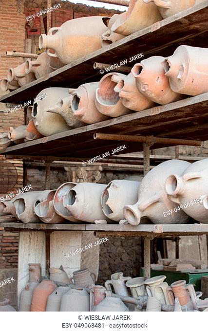 Vessels, pots and a variety of artifacts surviving eruption of Vesuvius in Pompeii have been excavated and catalogued .Pompei, Italy