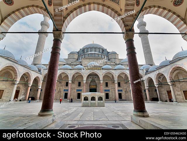 Istanbul, Turkey - April 17, 2017: Courtyard of Suleymaniye Mosque at early morning with few tourists visiting the place