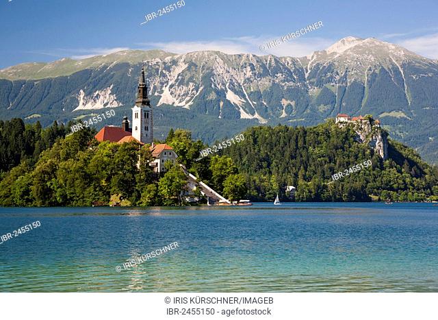 Lake Bled, overlooking the Pilgrimage Church on Bled Island, Bled Castle and the Kamnik Alps, Triglav National Park, Slovenia, Europe