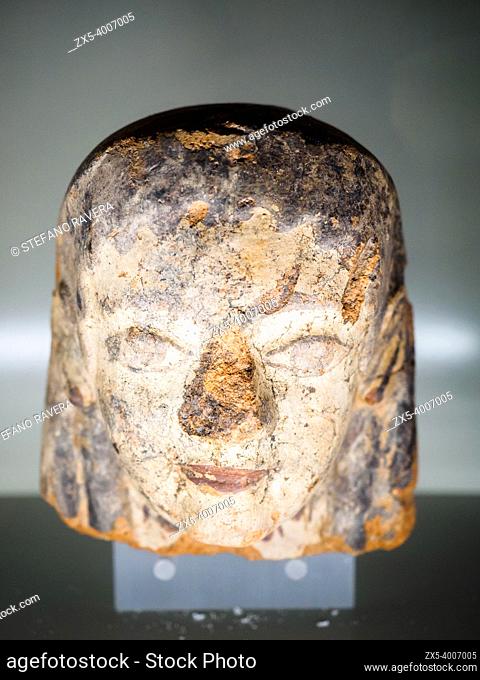 Terracotta antefix in female head with face with long eyes to hair with short wavy locks 530 BC - National Etruscan Museum of Villa Giulia - Rome, Italy