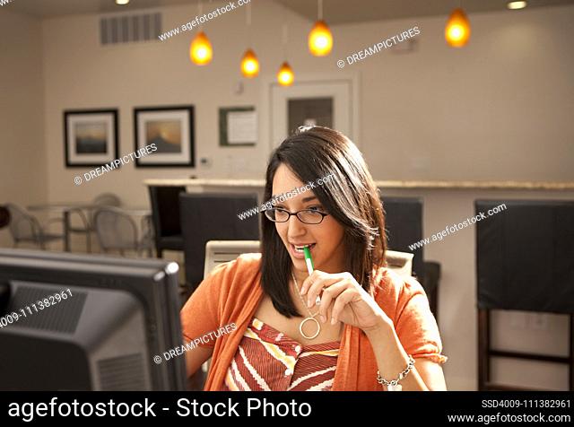 Hispanic woman using computer