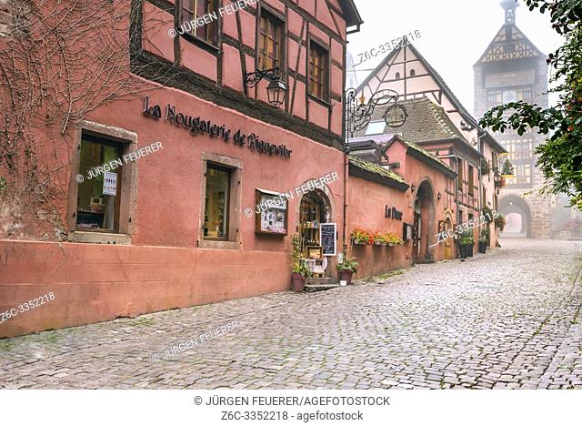 medieval town and tourist destination Riquewihr, village of the Alsace Wine Route, France, medieval mood in the autumn fog