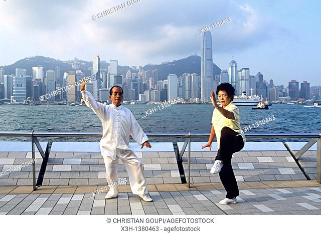 people practising Tai Chi Chuan along the Victoria Harbour waterfront in Tsim Sha Tsui, Kowloon Peninsula, Hong-Kong, People's Republic of China, Asia