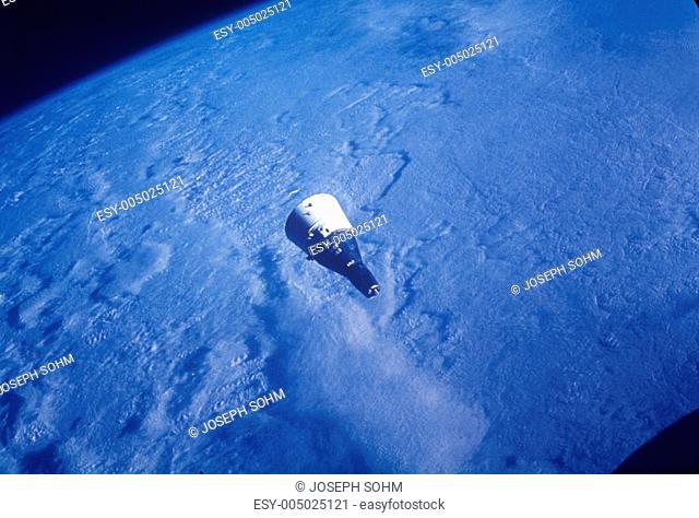 Gemini VI space capsule orbiting Earth