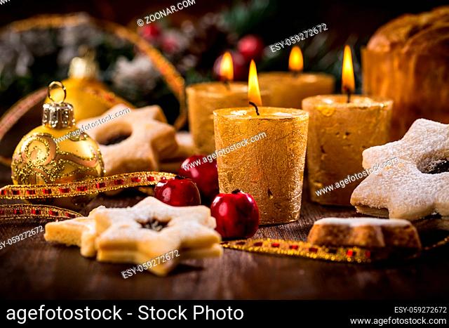 Christmas candles with homemade cookies in star shape