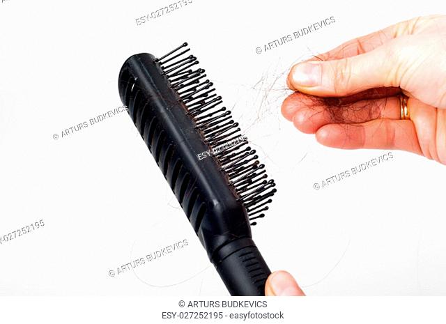 Hair loss - pulling hair out of the plastic hair brush by hand