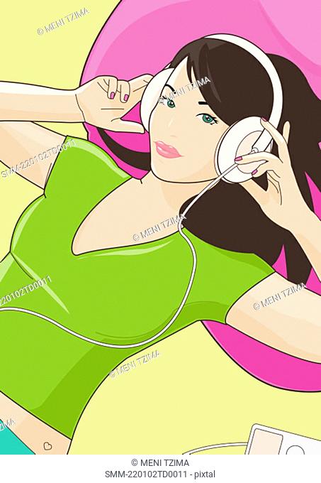 Woman lying down with her headphones