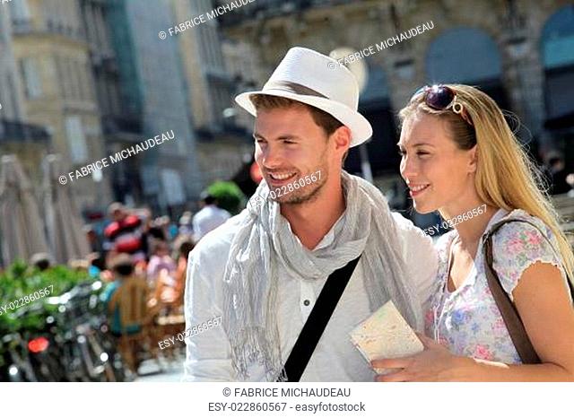 Young couple visiting city in summertime