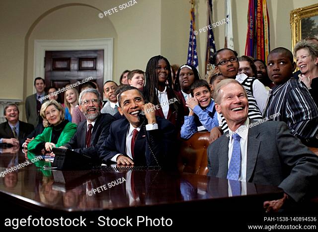 Washington, DC - March 24, 2009) -- United States President Barack Obama is joined by members of Congress and school children as he talks March 24, 2009