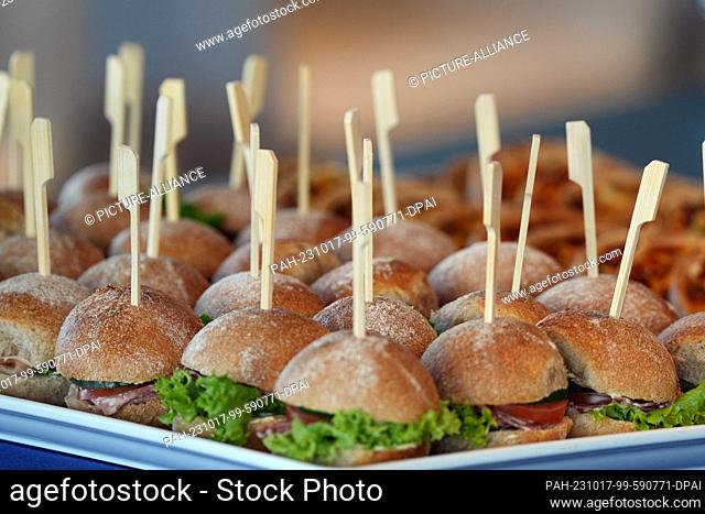 16 October 2023, Berlin: A plate of sandwiches stands on a table converted into a buffet during the opening. Photo: Soeren Stache/dpa