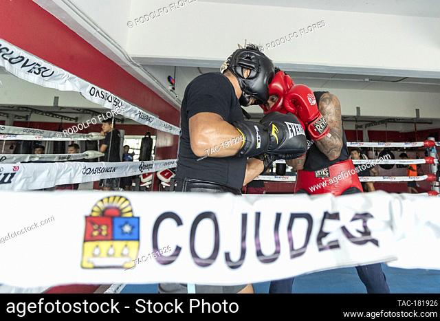 CANCUN, MEXICO - OCTOBER 20: Alexis Bastar (R) and Joselito Velazquez (L), boxing fighters training in the ring to prepares their bodies and improve their...