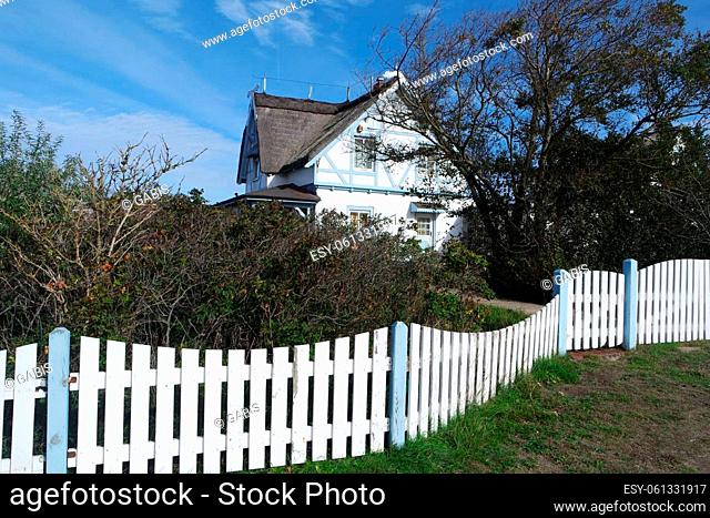 House behind a white picket fence