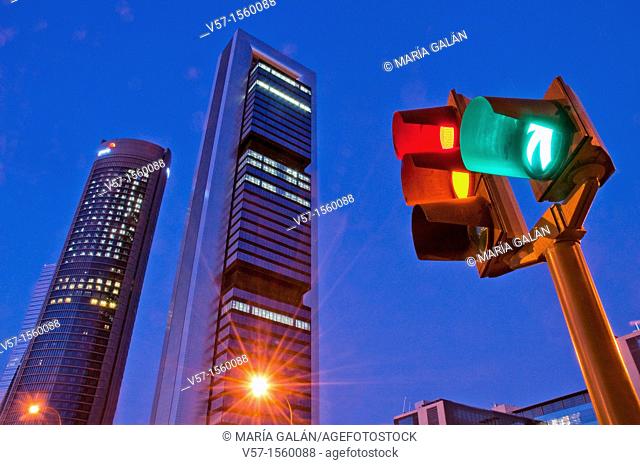 Traffic light and Four Towers, night view. Madrid, Spain