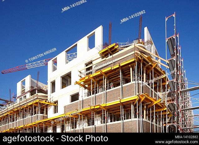 residential and commercial building in bremen's überseestadt, scaffolding, construction site, shell construction, bremen, germany, europe