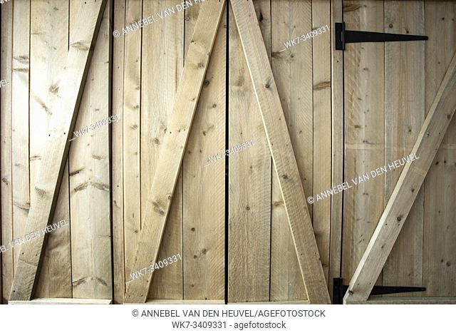 Traditional wooden barn doors detail of farm house doors, close-up clean and modern background textue