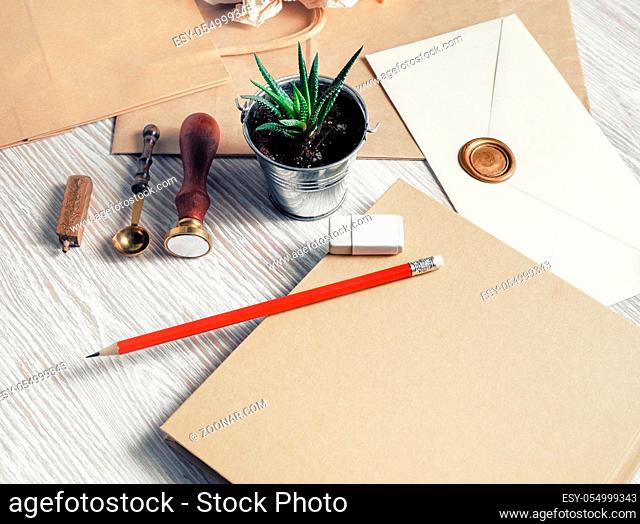 Blank retro stationery set on light wood table background. Mockup for your design