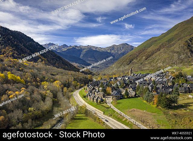 Aerial views of Garòs village and the surrounding forests in autumn (Aran Valley, Catalonia, Spain, Pyrenees)