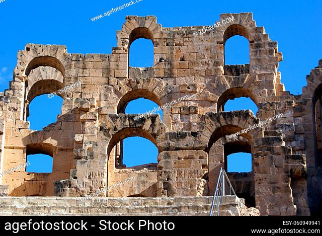 Wall of roman theater and blue sky in El-Jem, Tunisia