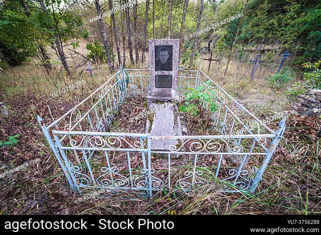 Cemetery in abandoned Zymovyshche village Chernobyl Nuclear Power Plant Zone of Alienation around nuclear reactor disaster in Ukraine