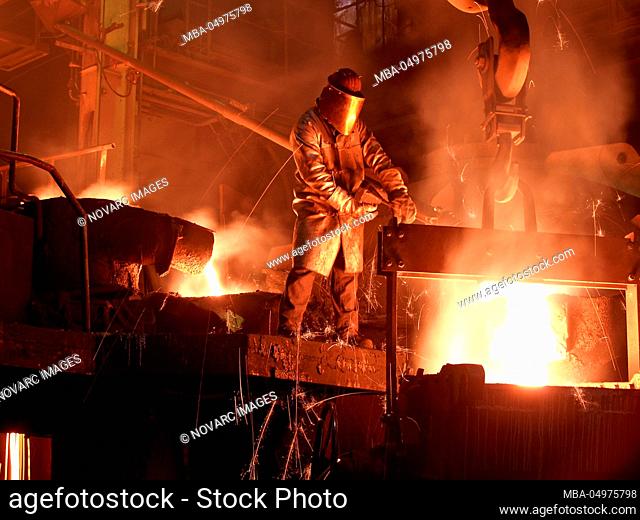 Steel industry, foundry, man in protective clothing, foundry, metal, liquid