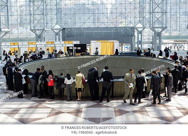 Job seekers attend the CUNY Big Apple Job and Internship Fair at the Jacob Javits Convention Center in New York. The US Labor Department reports new claims for...