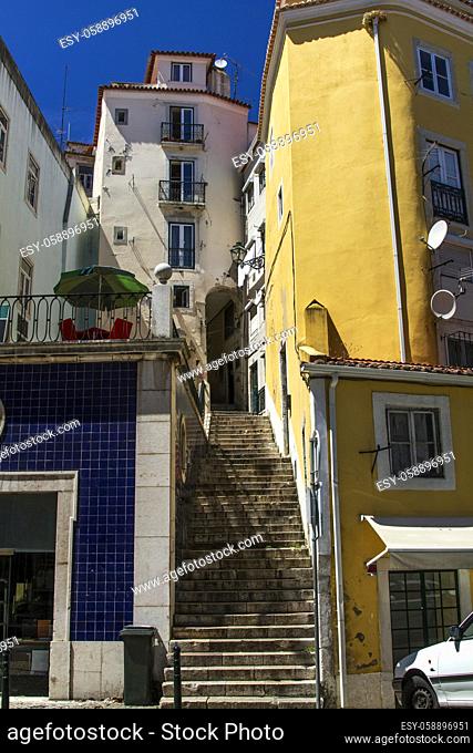 View of the typical narrow and convoluted streets with steps of Lisbon, Portugal