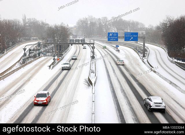 Essen, North Rhine-Westphalia, Germany - onset of winter in the Ruhr area, few cars drive on the A40 motorway in ice and snow