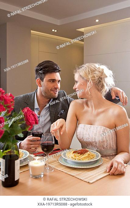 Couple having romantic dinner at home
