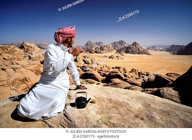 Bedouin having a tea break at the top of mount Jebel Burdah. Jordan, Wadi Rum desert, protected area inscribed on UNESCO World Heritage list