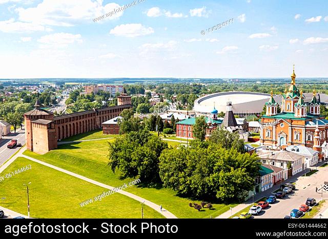 above view of wall and Tower of Kolomna Kremlin and Lazhechnikova Street with Uspenskiy Brusenskiy Monastery in Old Kolomna city on summer day from bell tower...