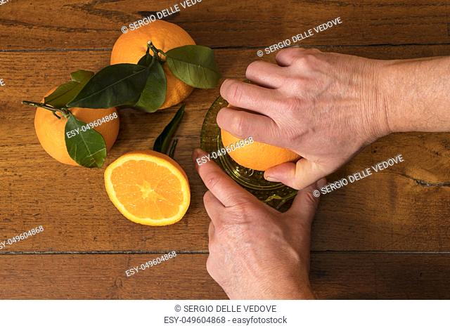 make a juice of oranges on a wooden table