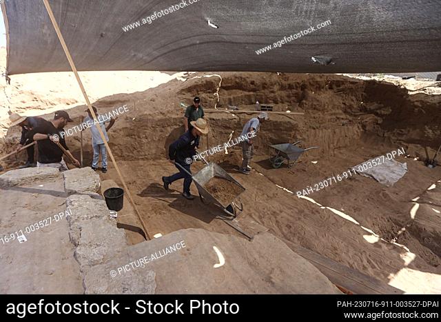 16 July 2023, Palestinian Territories, Beit Lahia: A Palestinian excavation team working at a Roman-era cemetery in the northern Gaza Strip