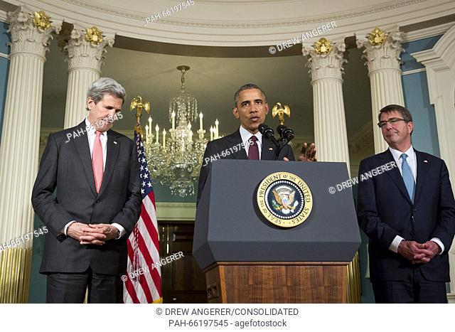 Flanked by United States Secretary of State John Kerry, left, and US Secretary of Defense Ashton Carter, right, US President Barack Obama makes a statement...