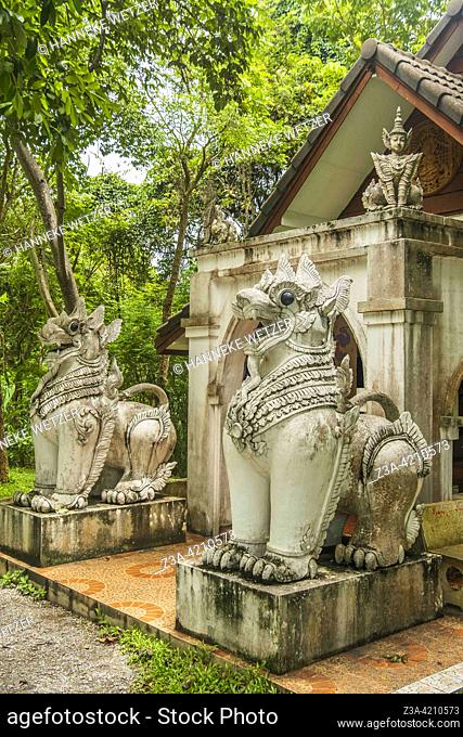 Mythological creatures statue at a hidden temple at Wat Pha Lat (temple on the slanting rock) in Chiang Mai, Thailand. Wat Pha Lat became a popular resting...