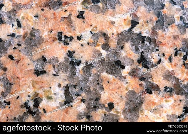 Pink granite. Granite is an igneous intrusive rock with holocrystalline texture. Polished surface