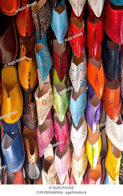 Rows of colorful leather slippers on market stall, Marakech, Morocco