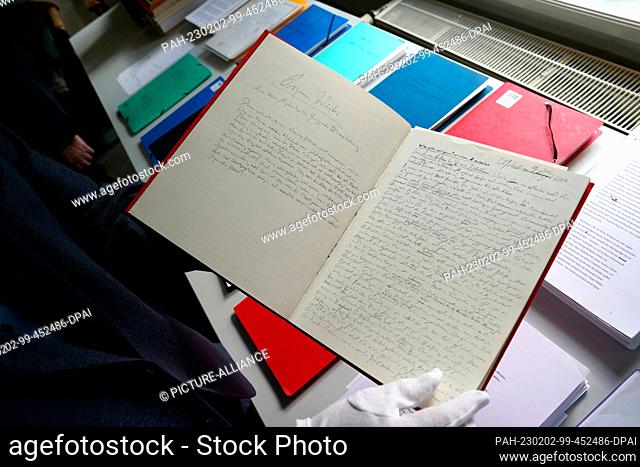 02 February 2023, Schleswig-Holstein, Lübeck: Jörg-Philipp Thomsa, director of the Grass House, leafs through a handwritten manuscript of ""Grimm's Words"" by...