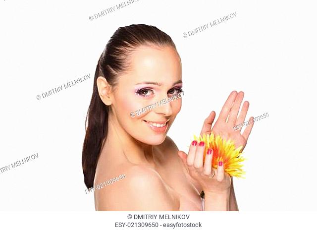 Beautiful young woman with a flower
