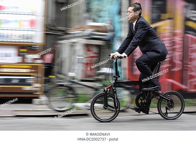 Businessman Riding Bike