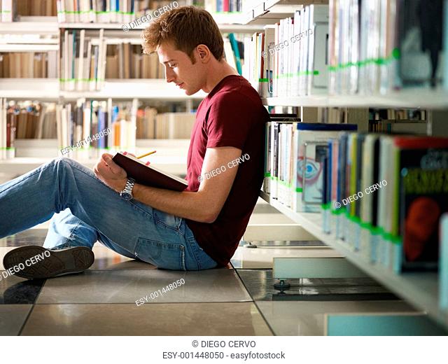guy studying in library