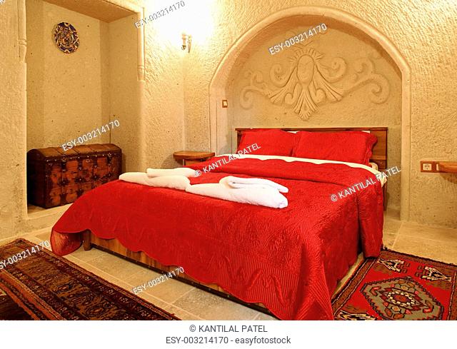 alcove archway bedroom layout red bedspread