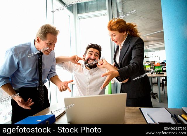 Angry bosses man and woman screaming, shouting and yelling at their worker. Handsome man having stress and closing with ears