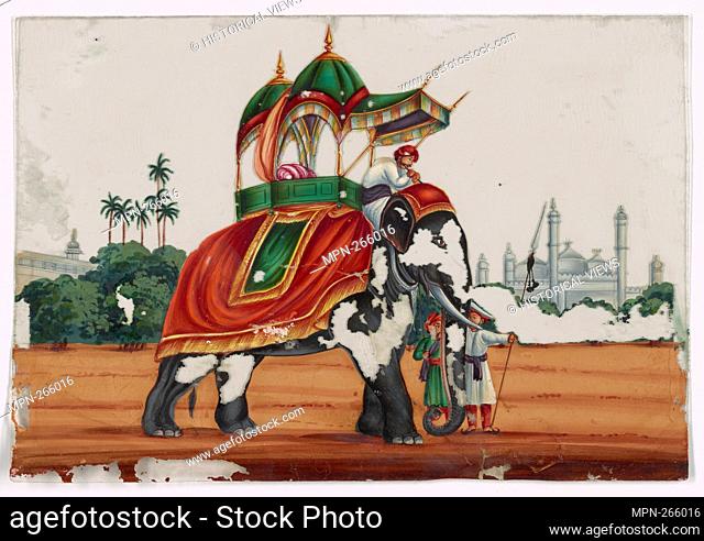 Elephant with caparison and howdah. Mahout in white robe and attendants, buildings in the background. Indian coloured drawings: a collection of 177 original...