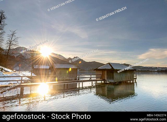Evening sun at the fishing huts of Kochelsee in the Bavarian foothills of the Alps