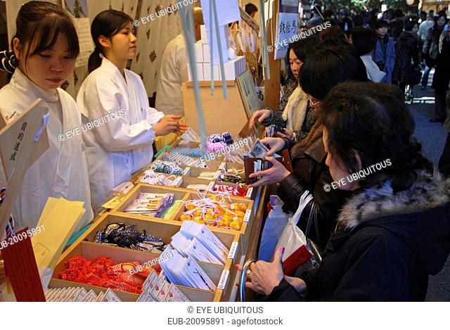 ingumae - Meijijingu shrine, New Years worshippers buying omamori good luck charms for the New year