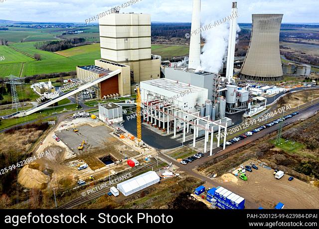 23 January 2020, Lower Saxony, Helmstedt: Construction vehicles are parked in front of the former Buschhaus lignite-fired power station on the construction site...